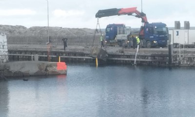 Efter stormflodsskader p� havnen � ender med et overskud