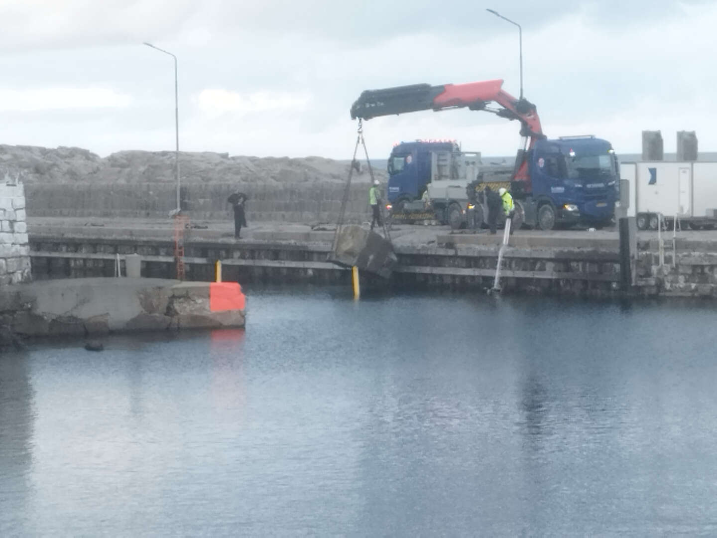 Efter stormflodsskader p� havnen � ender med et overskud