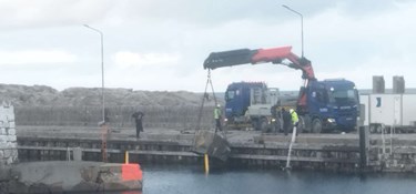 Efter stormflodsskader på havnen – ender med et overskud
